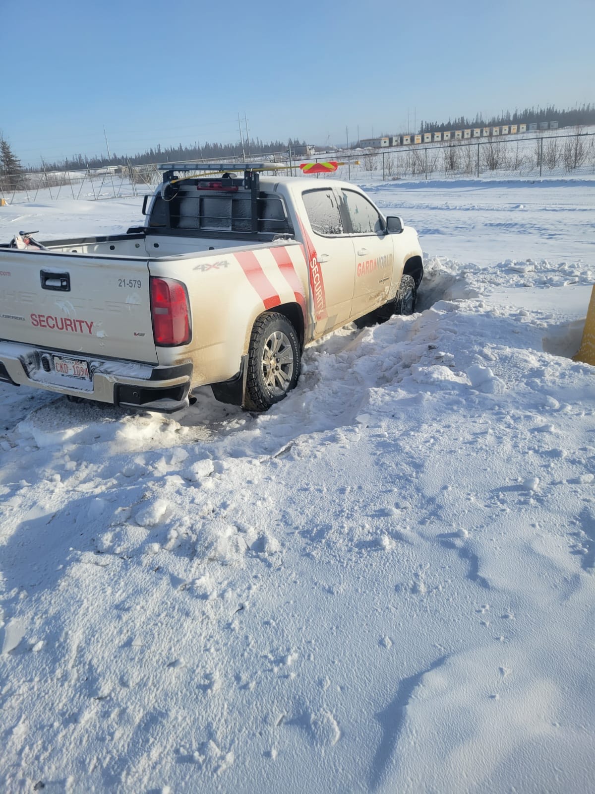 roadside assistance Fort McMurray - Cool Ride Towing helping stranded driver on snowy Fort McMurray road in winter